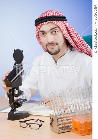 Arab chemist working in lab 5356584