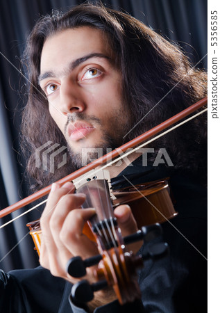 Young violin player playing 5356585