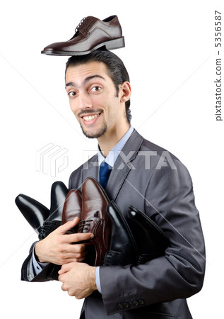 Man with a selection of shoes 5356587