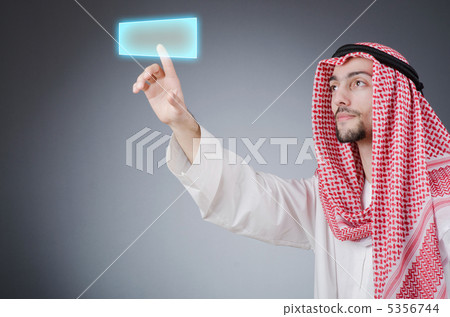 Young arab pressing virtual buttons Young arab pressing virtual buttons 5356744