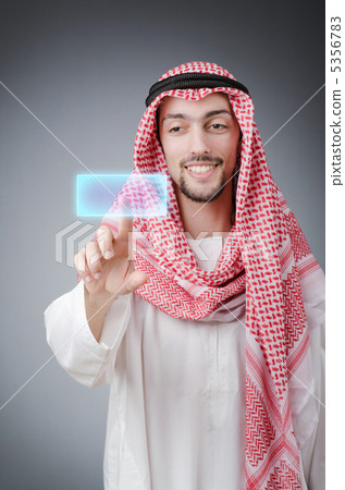 Young arab pressing virtual buttons Young arab pressing virtual buttons 5356783