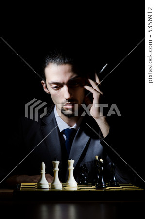Chess player playing his game Chess player playing his game 5356912