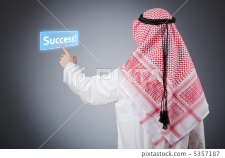 Young arab pressing virtual buttons Young arab pressing virtual buttons 5357187