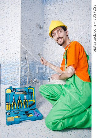 Plumber working in the bathroom 5357255