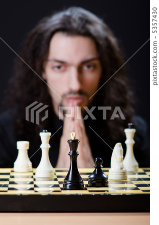 Chess player playing his game Chess player playing his game 5357430