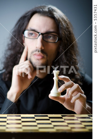 Chess player playing his game Chess player playing his game 5357431