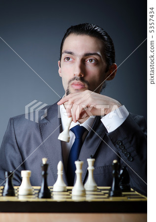 Chess player playing his game Chess player playing his game 5357434