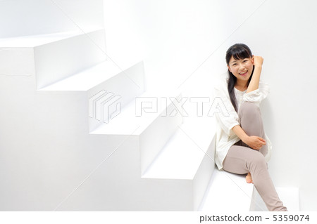 Girl sitting on the stairs 5359074