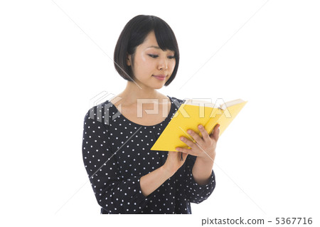 A woman reading a book A woman reading a book 5367716