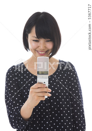 A woman watching a mobile phone 5367717