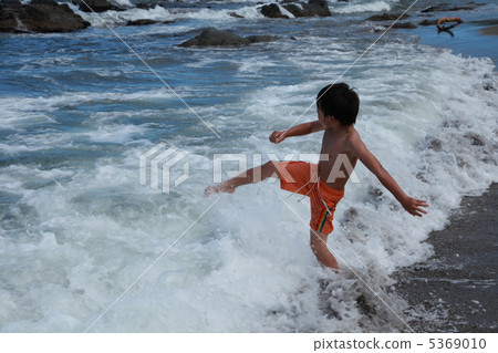 Boys playing in the sea 5369010