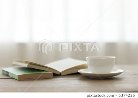 Tea and books on the table Tea and books on the table 5374226