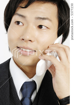Businessmen talking on mobile phones 5377230