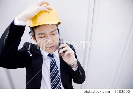 Businessmen talking on mobile phone Businessmen talking on mobile phone 5383000