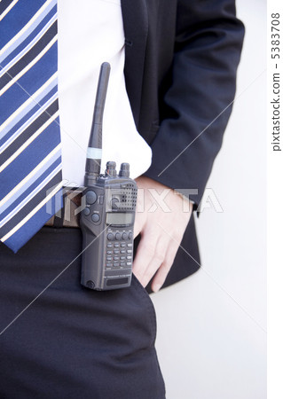 A businessman sitting on a walkie talkie 5383708