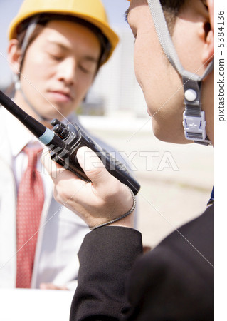 Businessman talking on the transceiver Businessman talking on the transceiver 5384136