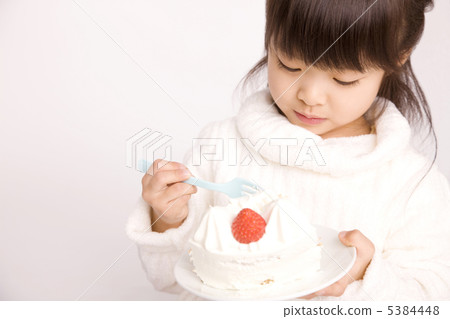 A girl who eats a cake A girl who eats a cake 5384448