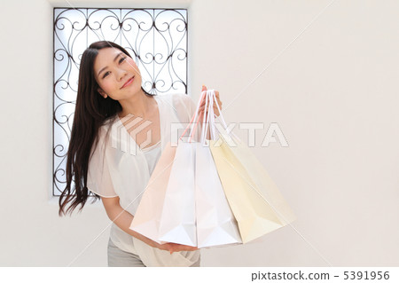 Woman on the way home from shopping 5391956