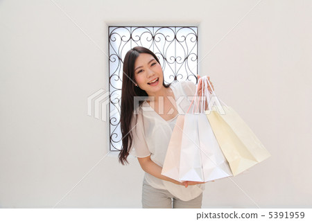 Woman on the way home from shopping 5391959