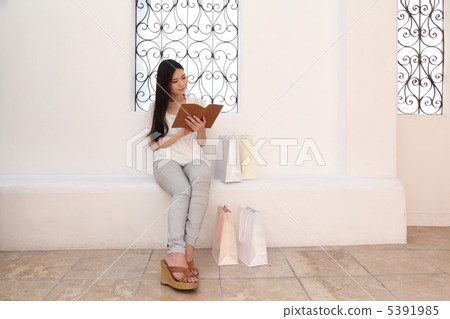 Woman on the way home from shopping 5391985