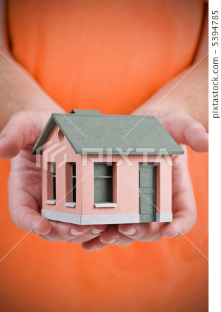Model of the small house in human hand Model of the small house in human hand 5394785
