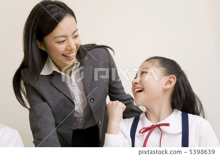 Female lecturer and elementary school student Female lecturer and elementary school student 5398639
