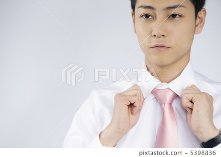 Businessman who corrects collar of shirt 5398836