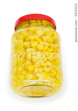 Sweet corn in glass jar isolated on white 5425423