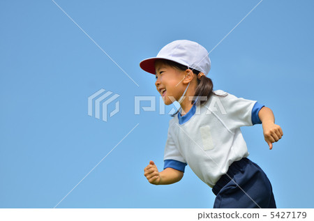 Girls running in the blue sky (gym clothes, red and white hat) Girls running in the blue sky (gym clothes, red and white hat) 5427179