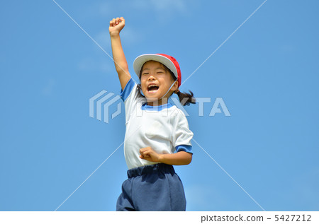 Girls posing in a blue sky (gym clothes, red and white hat) Girls posing in a blue sky (gym clothes, red and white hat) 5427212