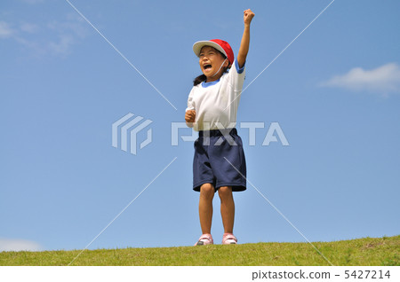 Girls posing in a blue sky (gym clothes, red and white hat) Girls posing in a blue sky (gym clothes, red and white hat) 5427214