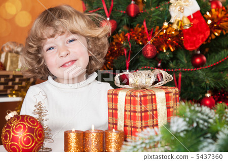 Happy child with gift Happy child with gift 5437360
