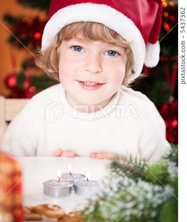 Funny smiling child in Santa`s hat 5437362