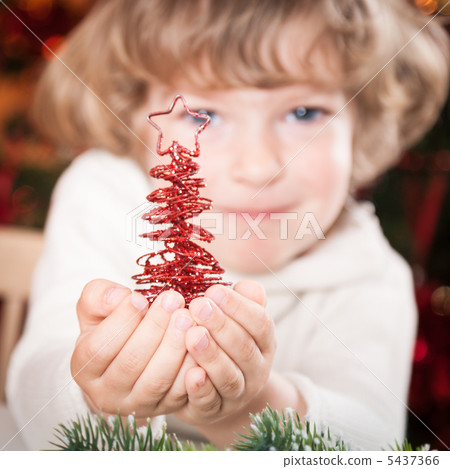 Happy child with Xmas decoration 5437366