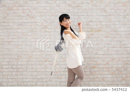 A street corner woman (umbrella) 5437412