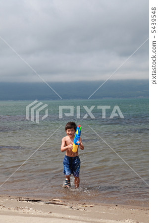 Boys playing with water guns Boys playing with water guns 5439548