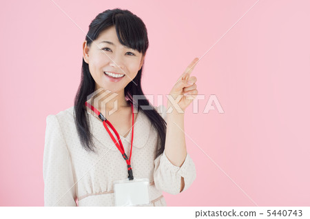 A woman wearing an ID card 5440743