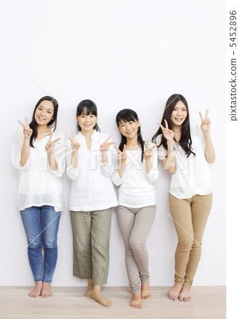 Four girls standing with a smile Four girls standing with a smile 5452896