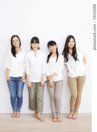 Four girls standing with a smile Four girls standing with a smile 5452898