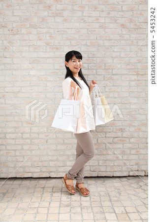 Woman on the way home from shopping 5453242