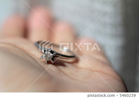 Woman's palm holding an old nail diamond 5460239