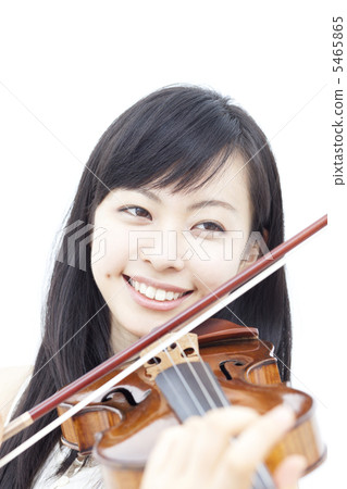 A woman playing a violin A woman playing a violin 5465865