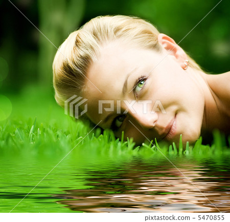 Beautiful Girl Lying On The Grass 5470855