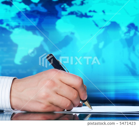 Businessman's hand with a pen. International business concept 5471423