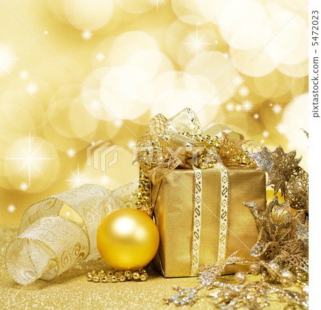 Christmas Decoration over Glittering Golden Background Christmas Decoration over Glittering Golden Background 5472023