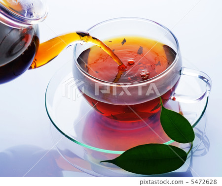 Pouring Healthy Tea Over White Pouring Healthy Tea Over White 5472628