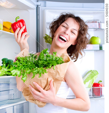 Beautiful Young Woman near the Refrigerator with healthy food 5484030