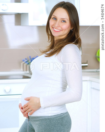 Pregnant Young Woman at home. Happy Pregnancy 5484674