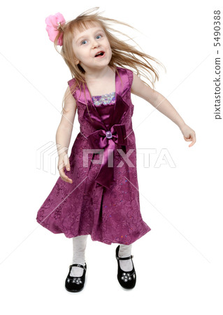 Full length of cheerful young girl jumping in joy over white bac 5490388