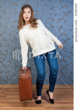 girl with an old brown suitcase 5490389